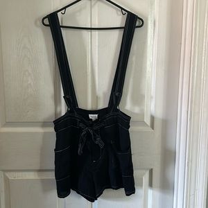 LELIS Black with white detail shorts romper.  Size small.  Loose fit.